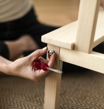 Woman assembling a diy chair from scratch